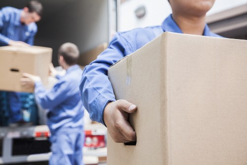 Man with van loading items for a move in White City