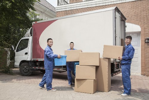 Professional movers assisting with a residential move in White City