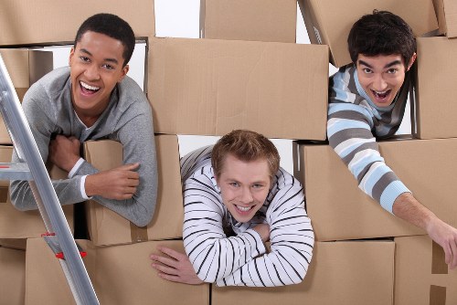 Local movers organising boxes and fragile items in White City