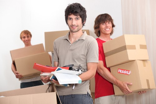 Packed boxes and furniture ready for a home move in White City