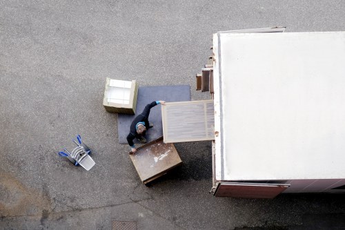 Office relocation planning in White City with desks and packing materials
