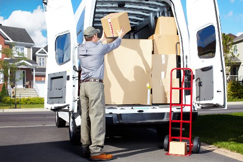 Loading furniture and boxes into a van for a White City move