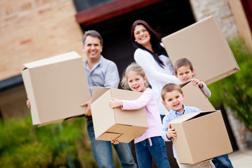 Unpacking boxes into a new White City property after delivery