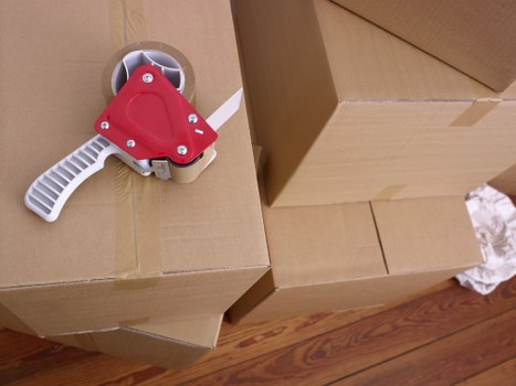 Commercial removals team transporting office furniture in West London