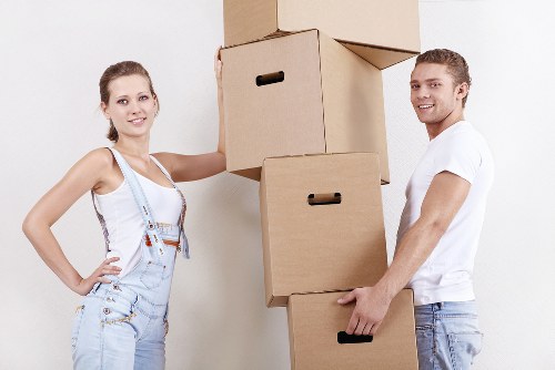 Furniture and boxes being loaded into a removal van in White City