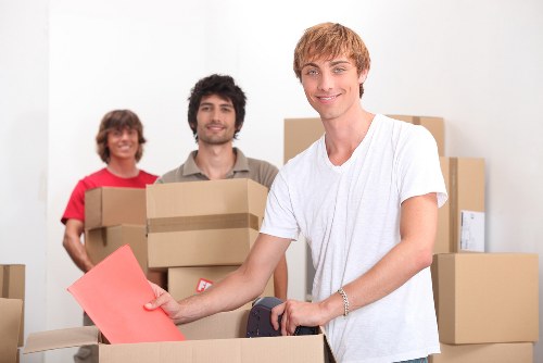 Local White City removals team handling furniture and boxes